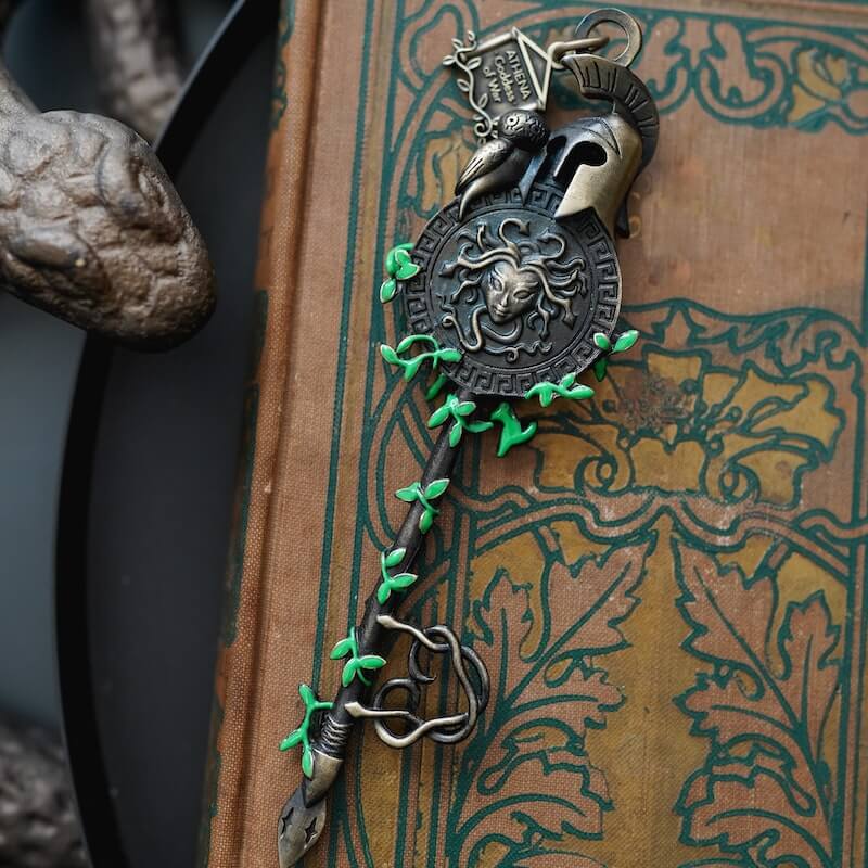Athena Greek Mythology Key sold by LitJoy with Athena's aegis, an owl, and helmet