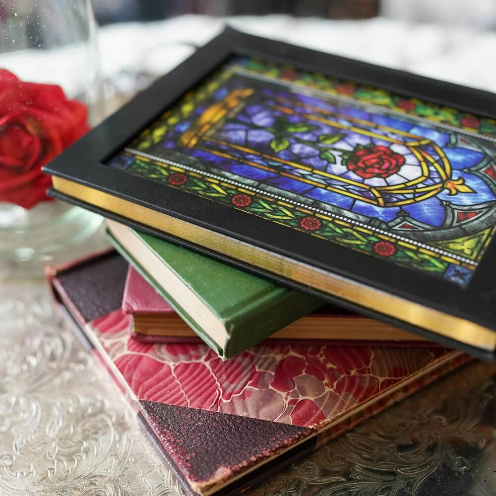Beauty and the Beast Fairytale Notebook with a rose in stained-glass art on the cover