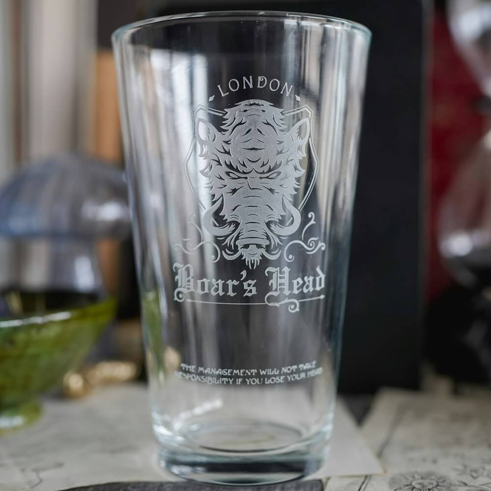 Shakespeare Boar's Head Pub Glass is a tall and clear cup with an etched boar's head and the words "London" and "Boar's Head"