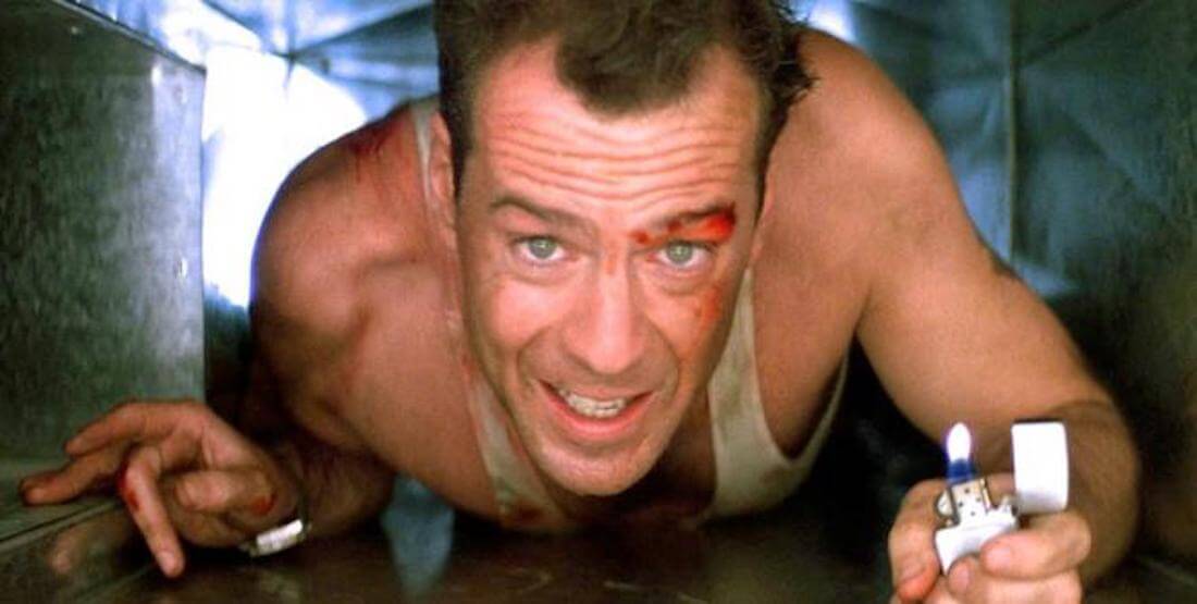 Bruce Willis as John McClane in Die Hard crawling through the vents
