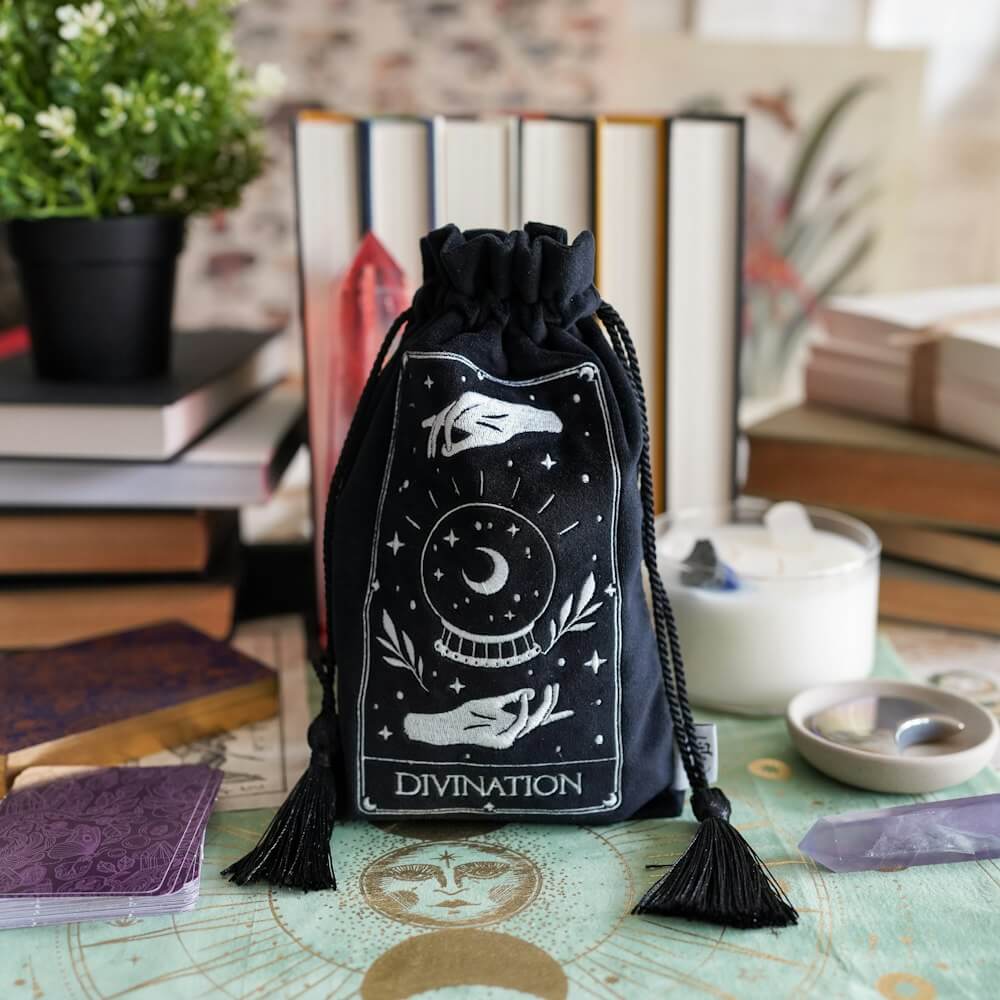 Black Divination Tarot Bag with white embroidery of a crystal ball with two hands above and below. 