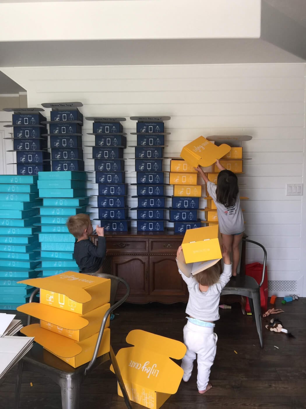 Alix and Kelly's young toddlers helping with LitJoy Crate boxes