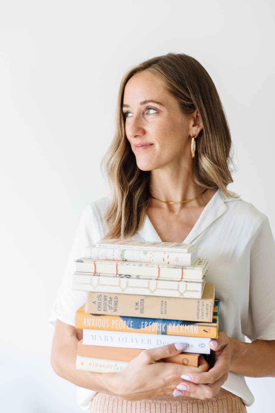 Kim Christenson Book Influencer holding books