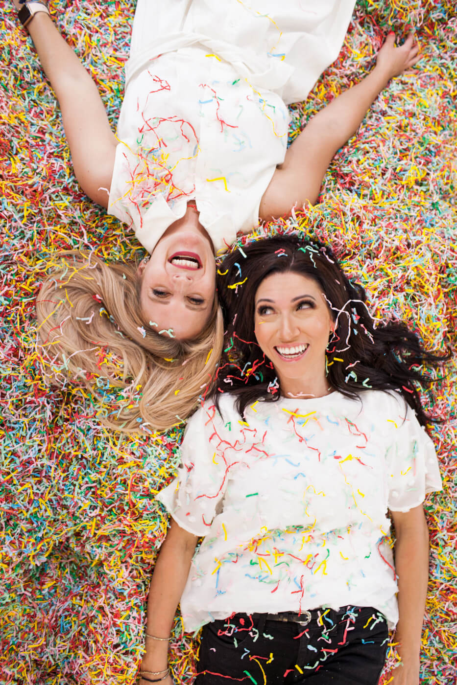 Alix and Kelly surrounded by confetti