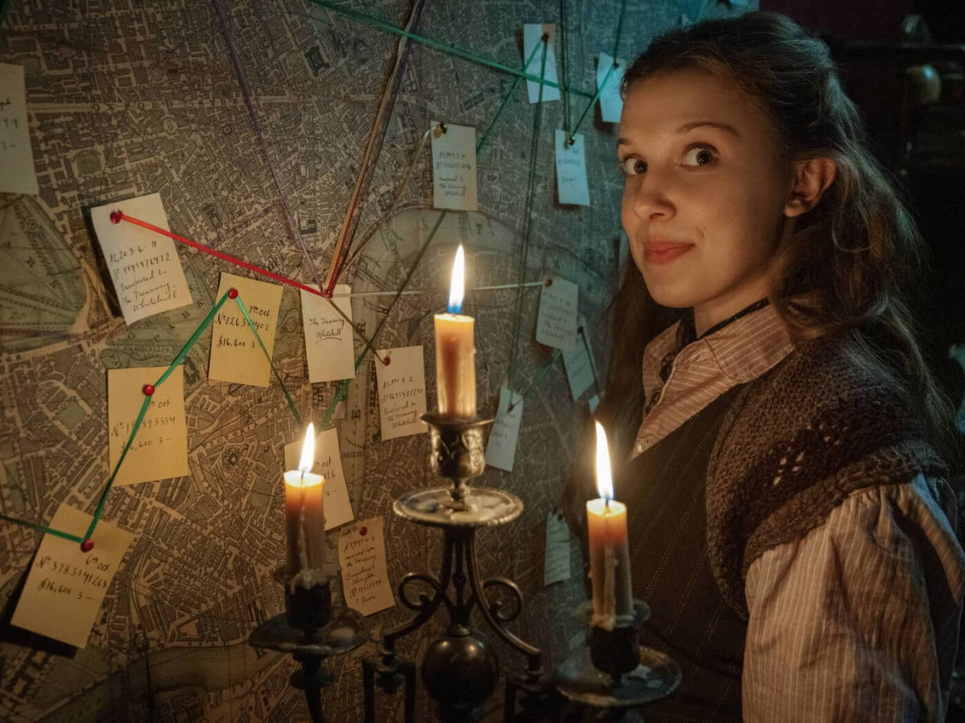 Enola Holmes as portrayed by Millie Bobby Brown, speaking of peculiar people, this is Sherlock's sister