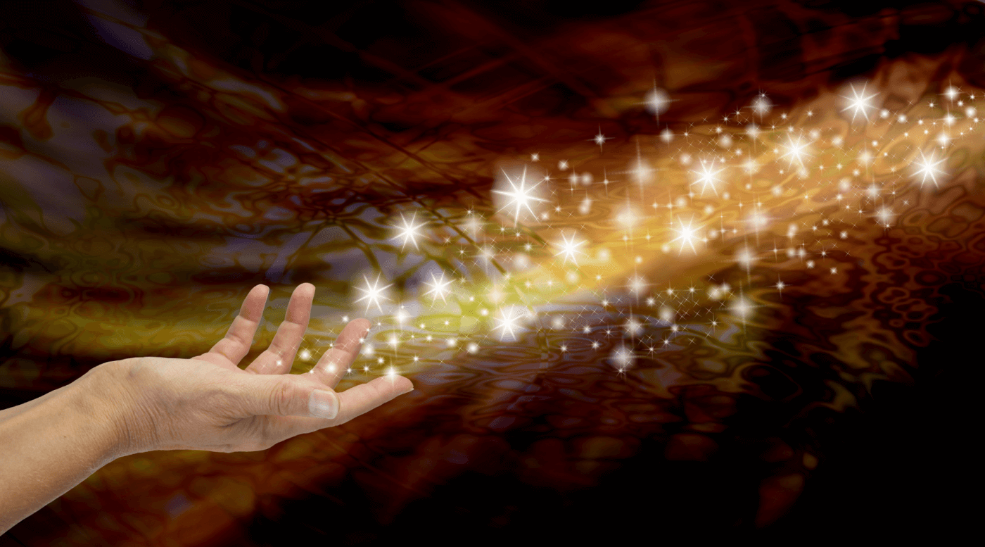 An open hand with magical stars