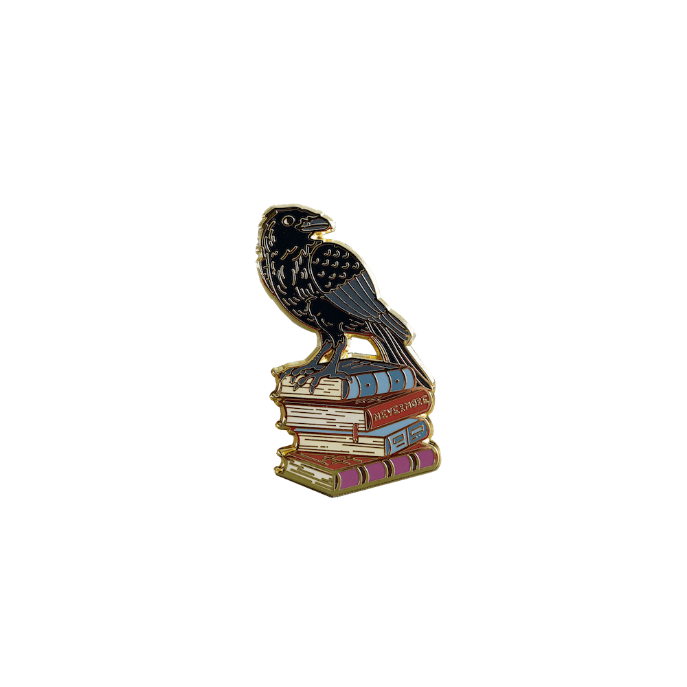The Raven sitting on a stack of books - enamel pin