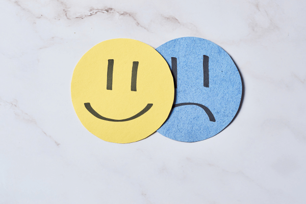 Yellow Smiley Face and Blue Grumpy Face
