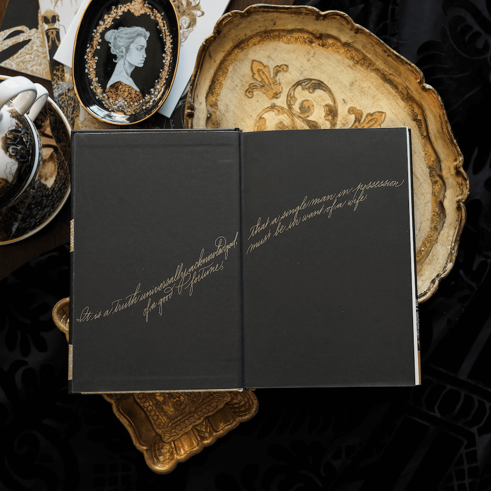 front endpapers of LitJoy's Pride and Prejudice stating "It is a truth unversally acknowledged, that a single man in possession of a good fortune, must be in want of a wife."
